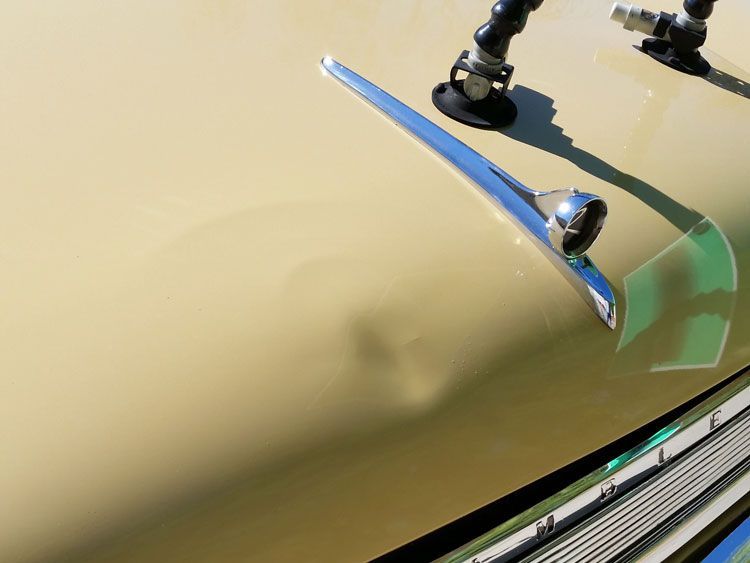 A close up of the hood of a car