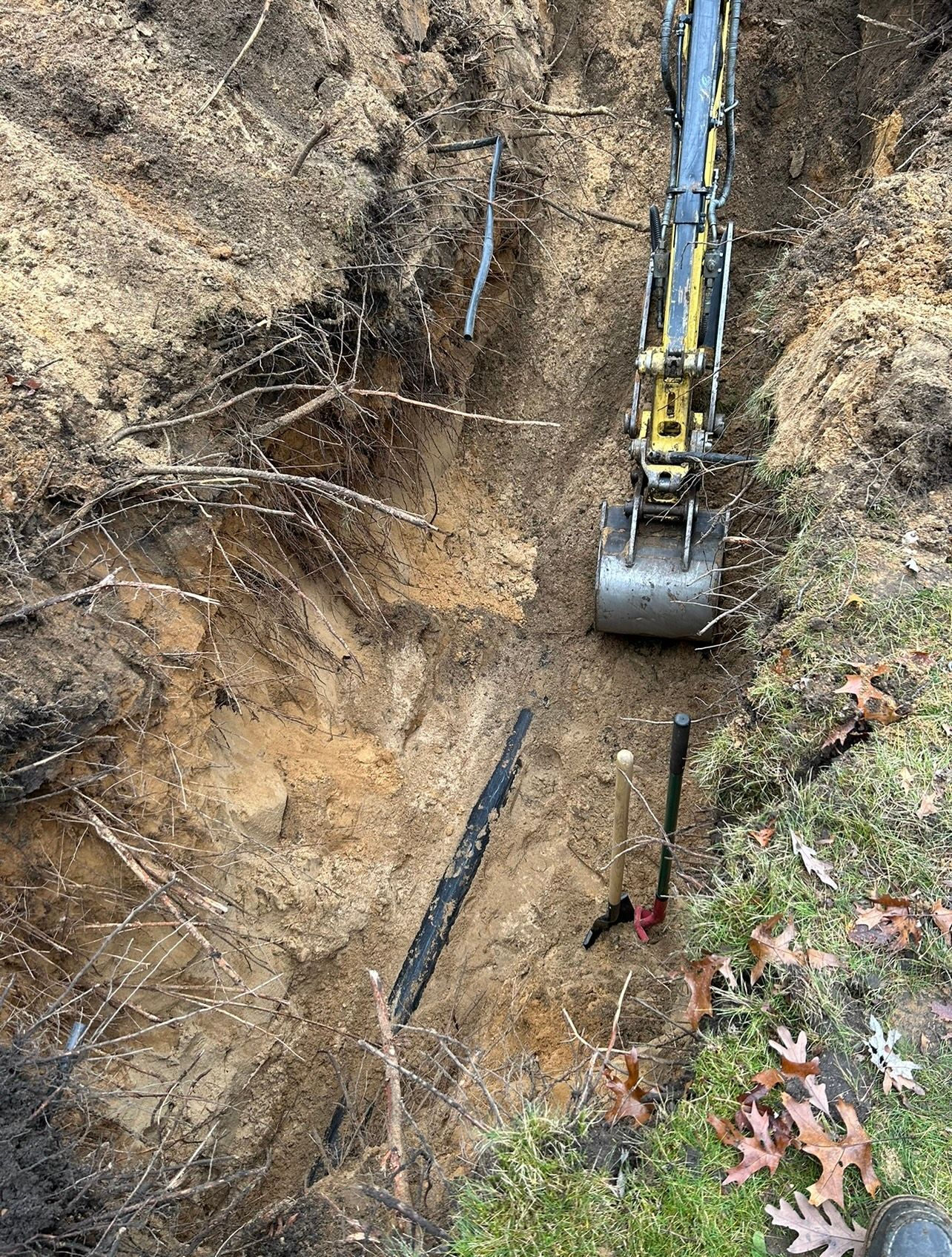 An excavator is digging a hole in the ground.