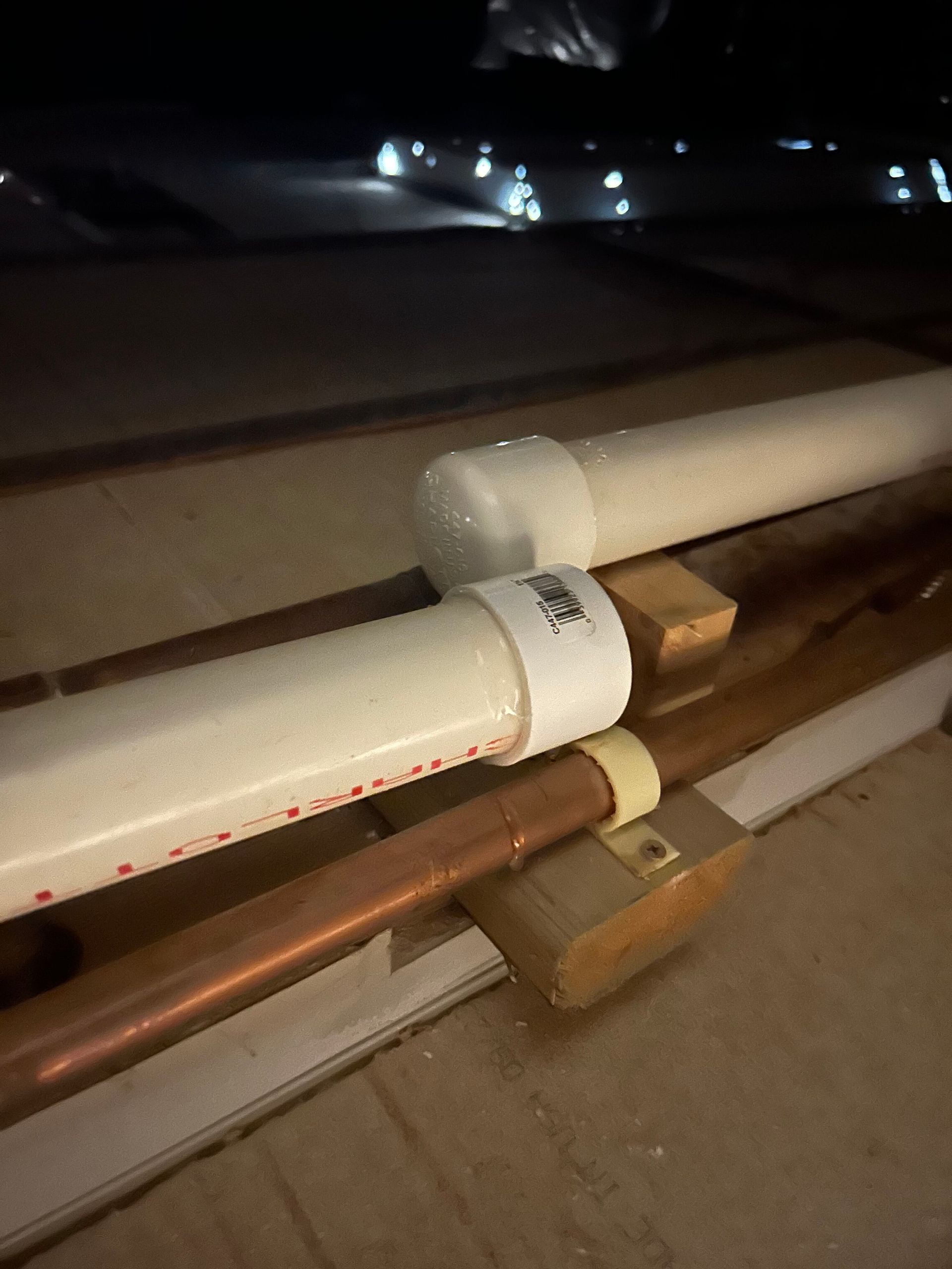 A bunch of pipes are sitting on top of each other on a table.