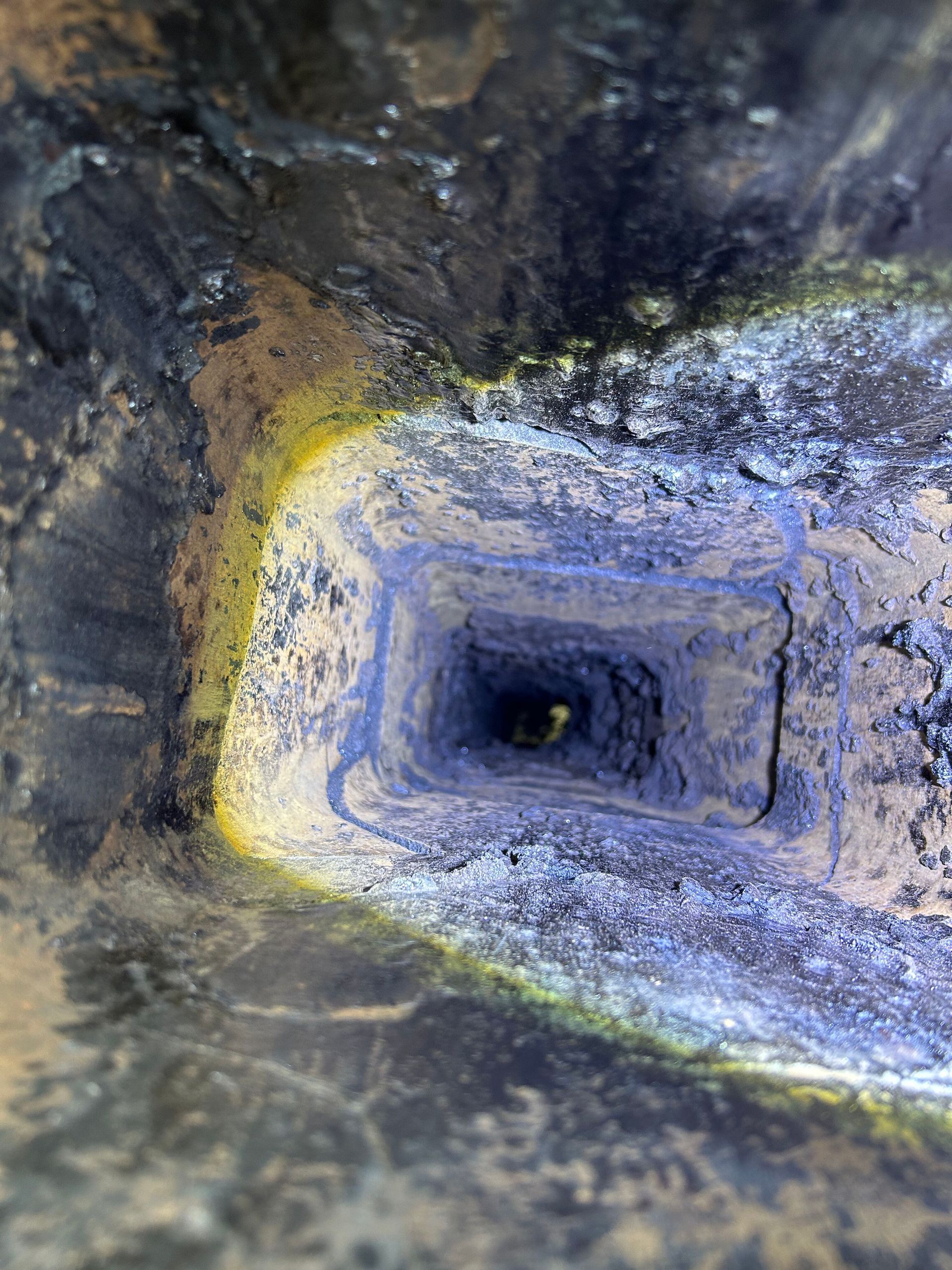 A close up of a hole in a rock.