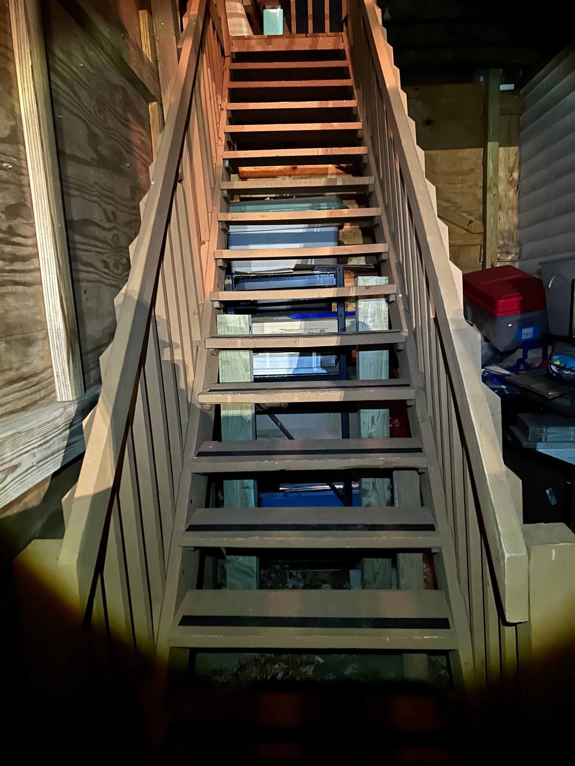A set of wooden stairs leading up to a building