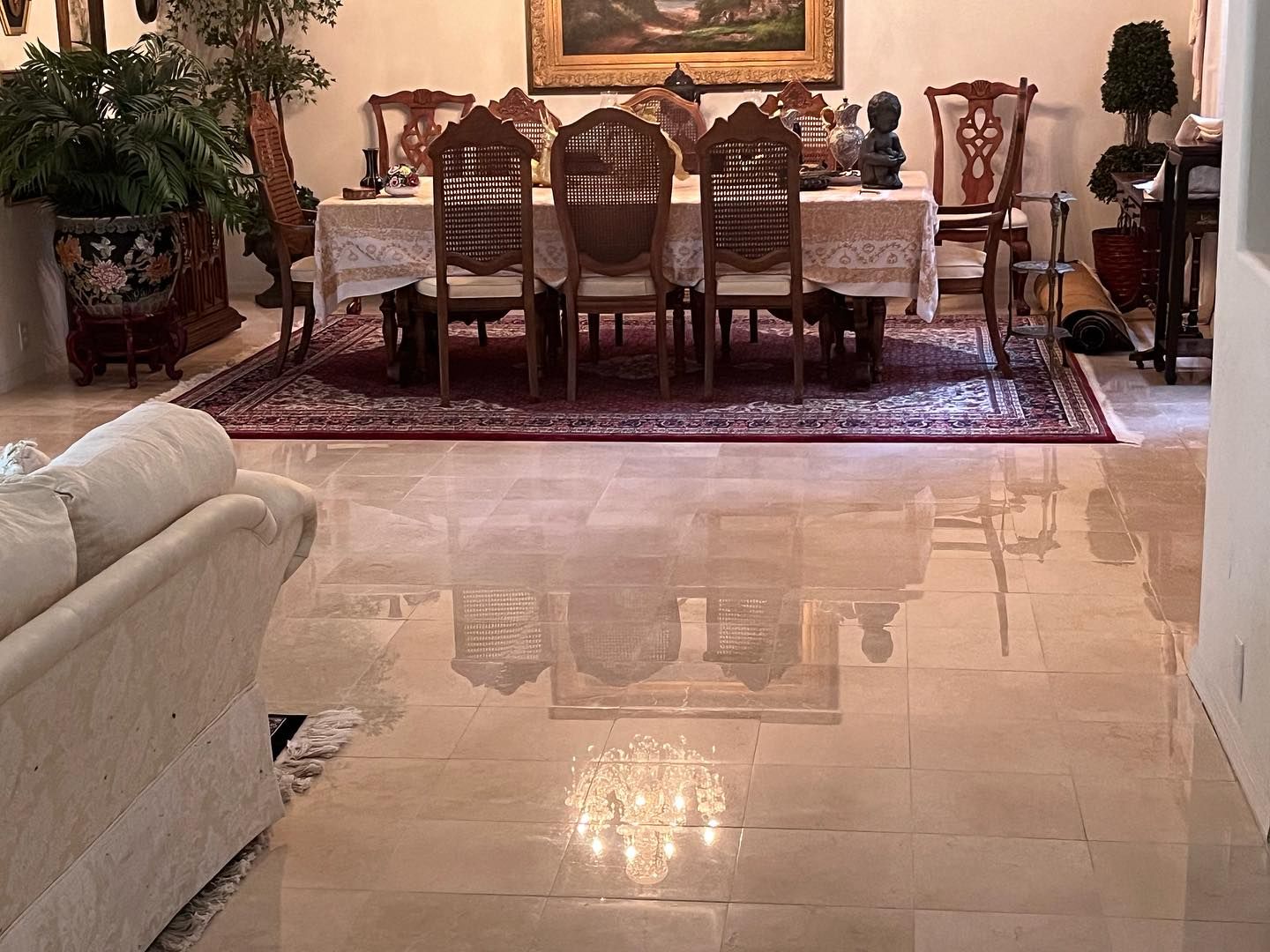 A living room with a dining room table and chairs