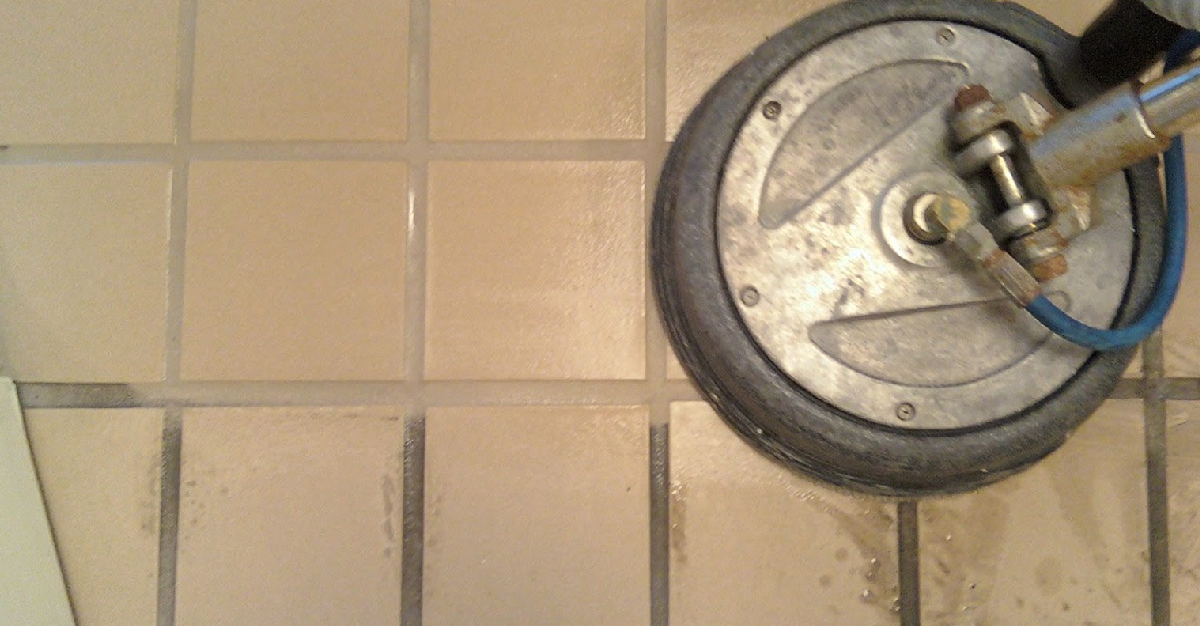 A tile floor is being cleaned with a machine.
