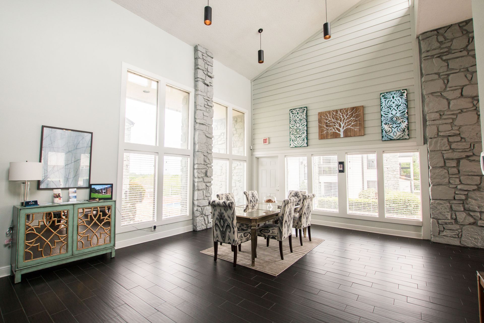 A large room with a table and chairs in it