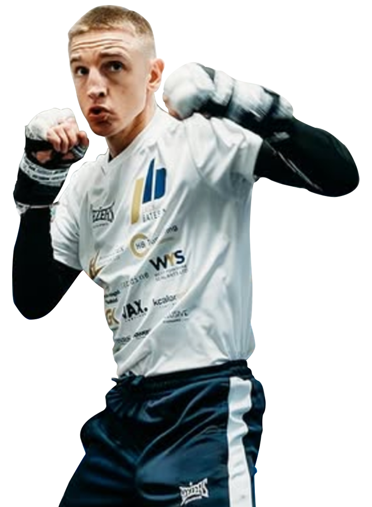 Young male boxer in training pose, wearing white shirt, black pants, and hand wraps.