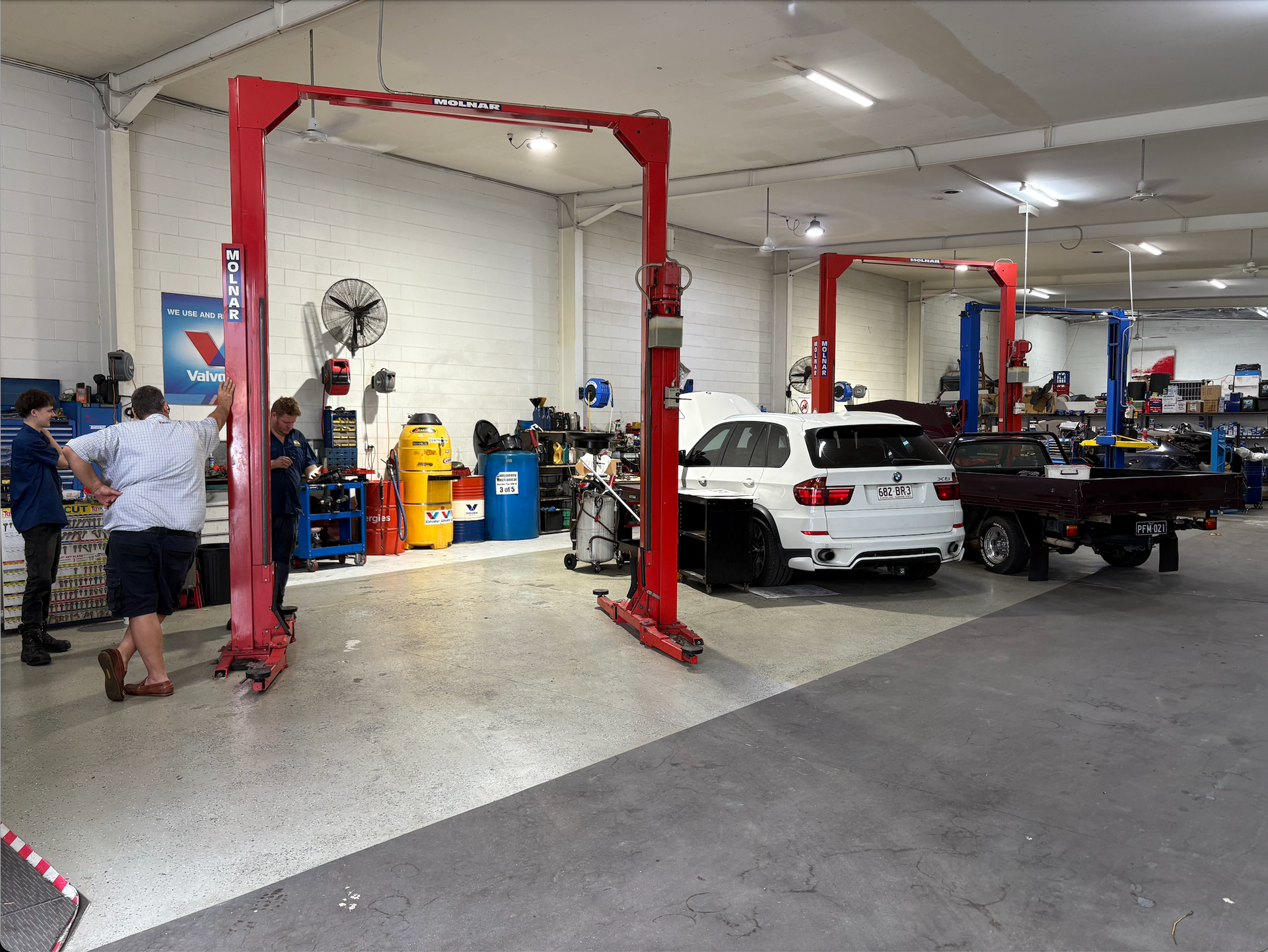 Two Cars Begin Worked on in a Garage — Monypenny Mechanical in Bungalow, QLD