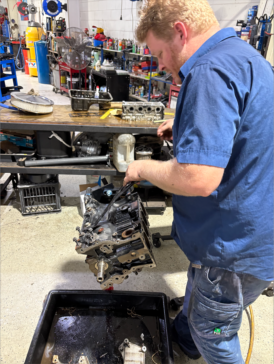A Man Working on a Car Engine — Monypenny Mechanical in Smithfield, QLD
