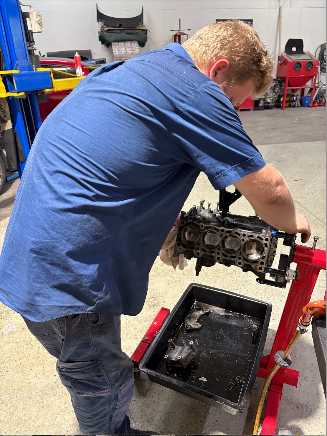 A Man Fixing the Engine of a Car — Monypenny Mechanical in Bungalow, QLD