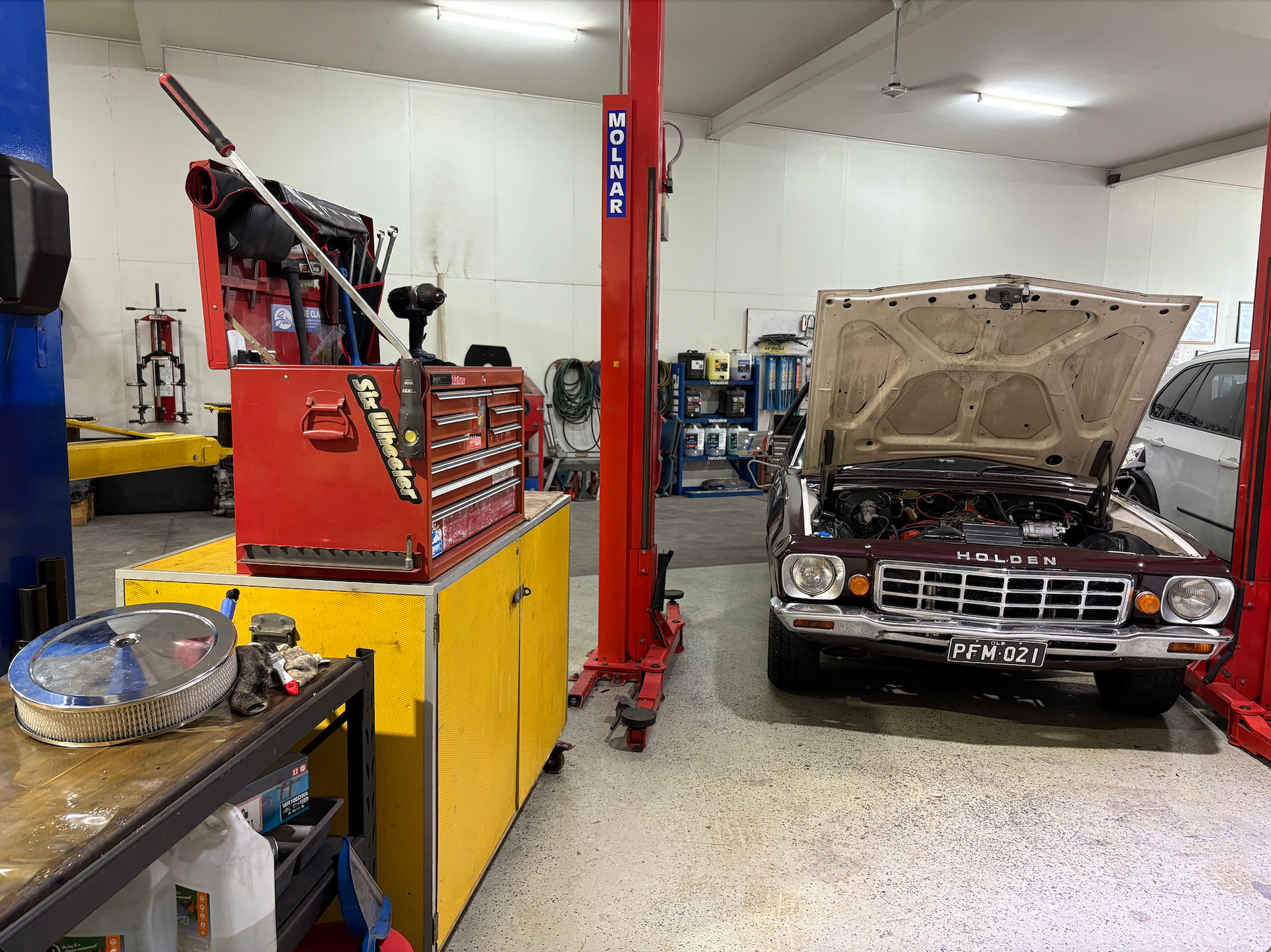 A Car with it's Bonet Up and Tools Around — Monypenny Mechanical in Bungalow, QLD