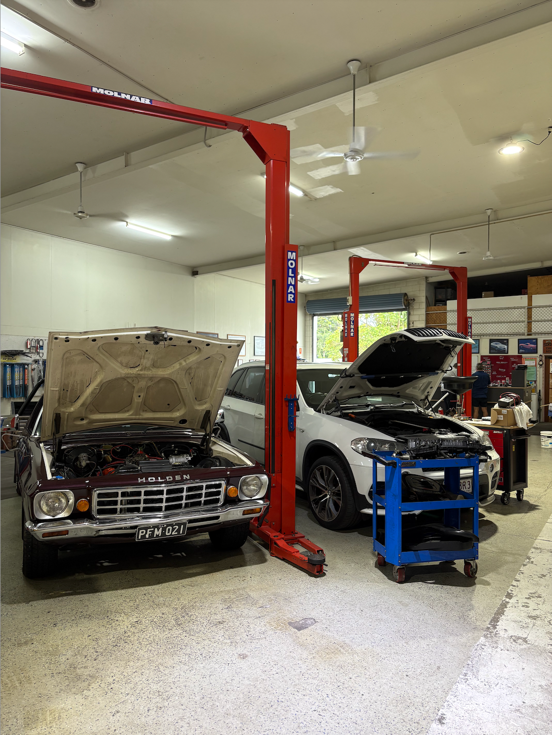 Cars getting Worked on in a Garage — Monypenny Mechanical in Bungalow, QLD