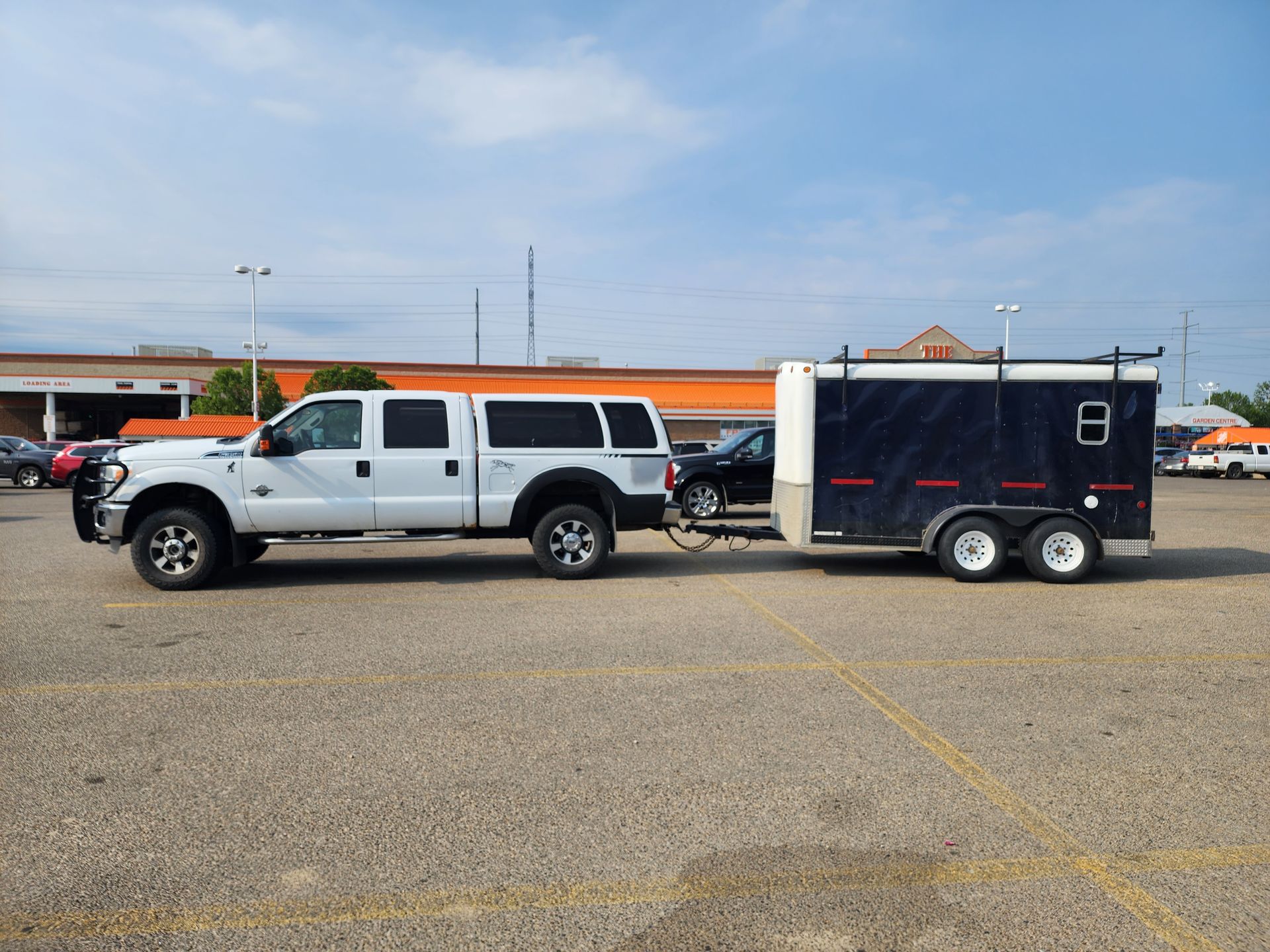 Calgary, AB: 1 ton work truck with cargo trailer.