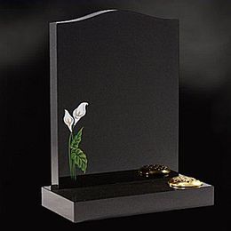 headstone with  a single flower