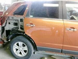 A car is being repaired in a garage.