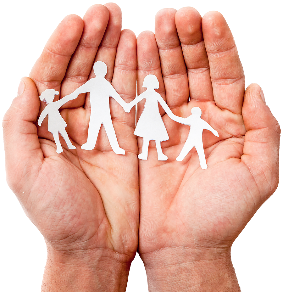 A person is holding a paper cut out of a family