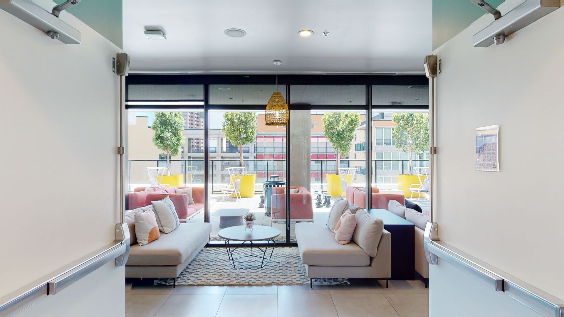 A living room with a lot of furniture and a large window.