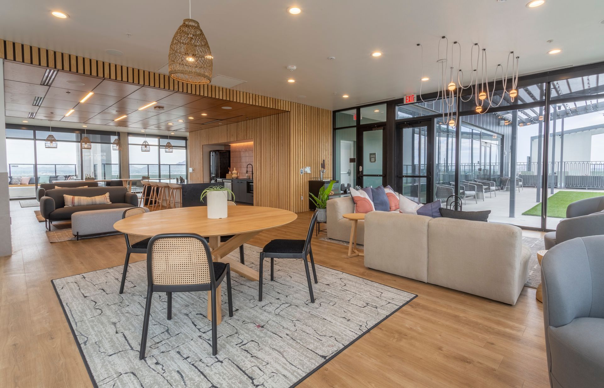 There is a table and chairs in the middle of the room.