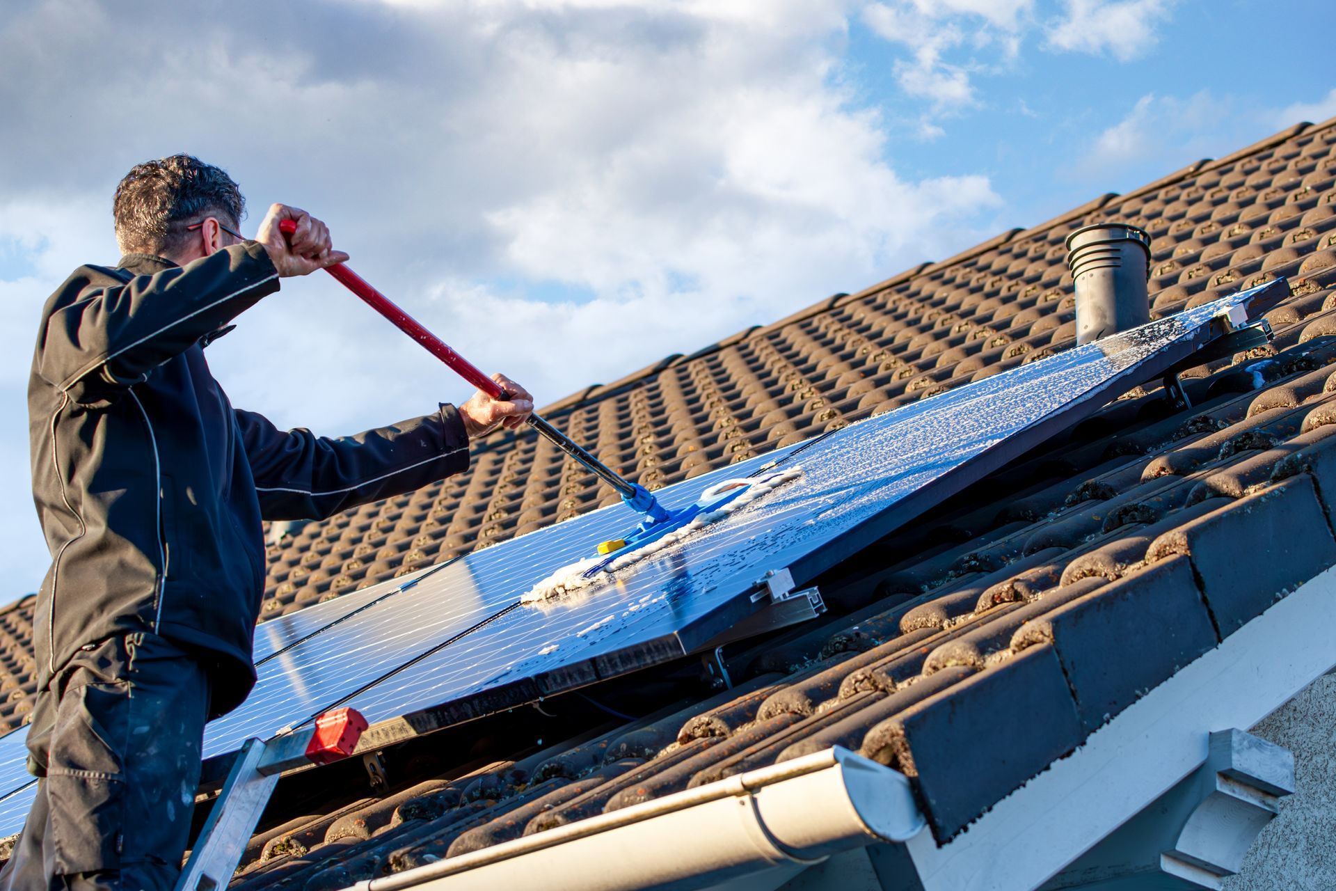 solar panel cleaning,man cleaning solar panel