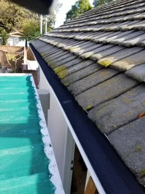 A close up of a gutter on a roof