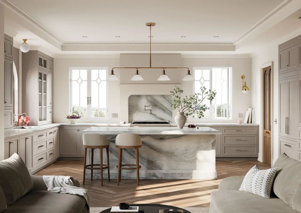 Elegant kitchen with marble island, gray cabinets, and two tufted stools; overhead lighting.