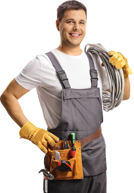 A man in overalls is holding a wire and a tool belt.