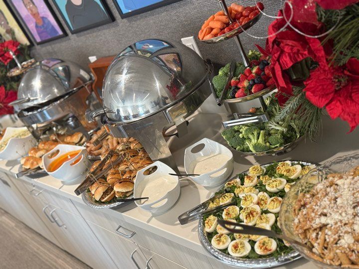 A buffet table with a variety of food on it