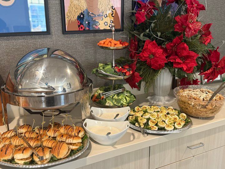 A buffet table with a bunch of food on it