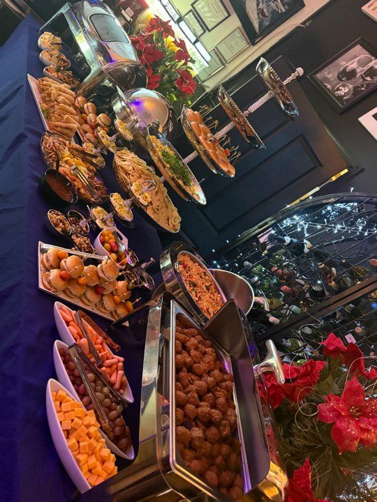 A buffet table with a lot of food on it