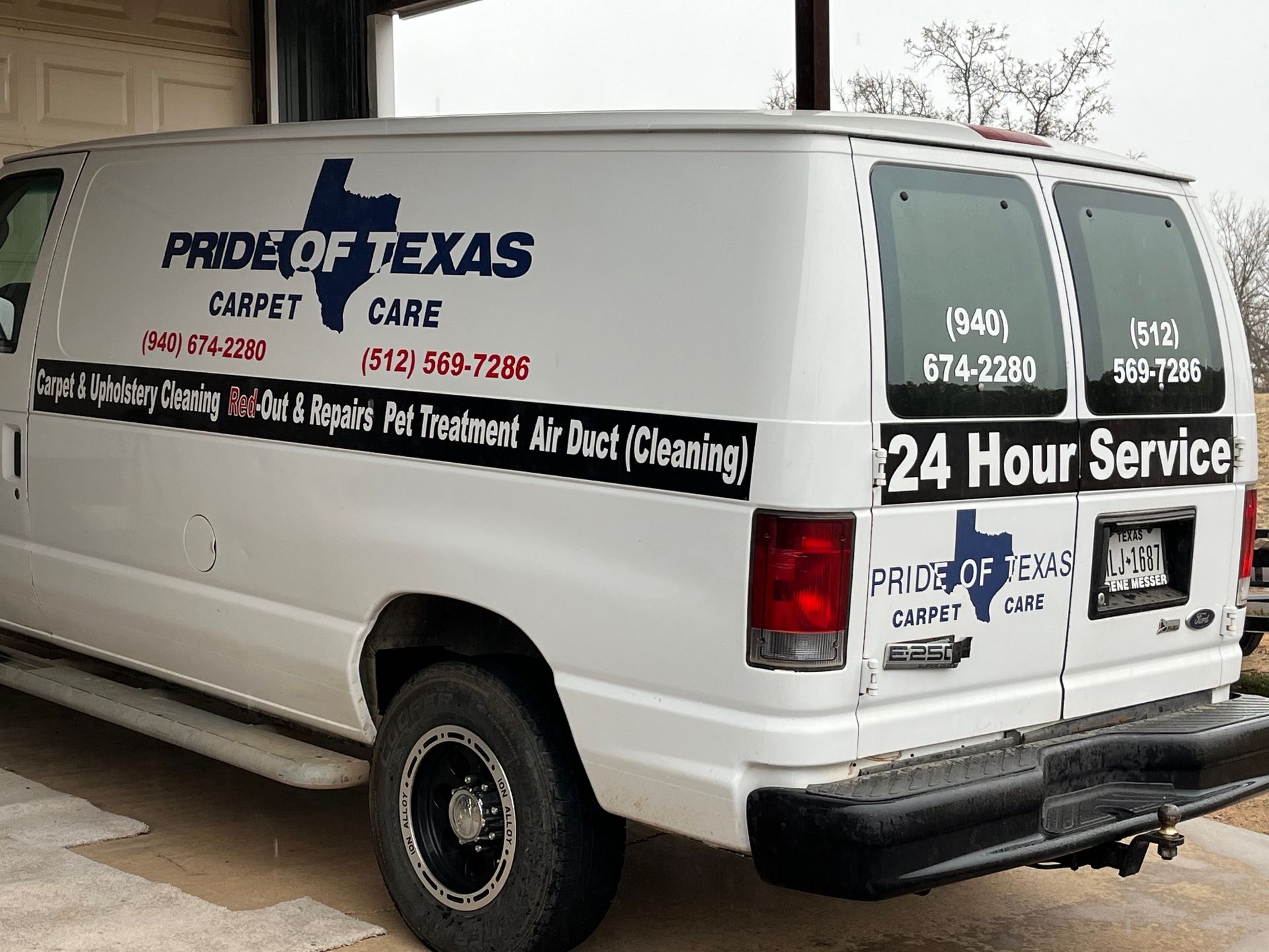 A white van with pride of texas written on the side