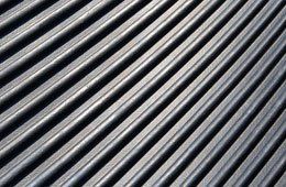 A close up of a black corrugated metal roof.