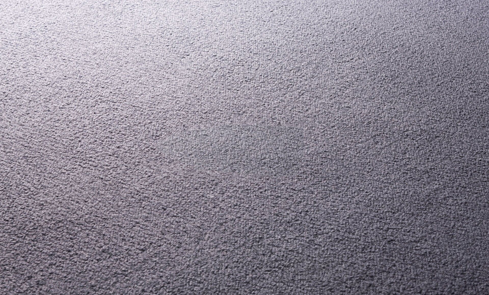 A close up of a gray carpet texture.