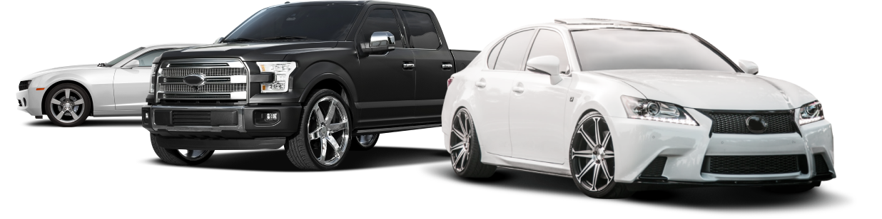 A black truck , a white car , and a white car are parked next to each other  | Greatway Tire and Auto Center
