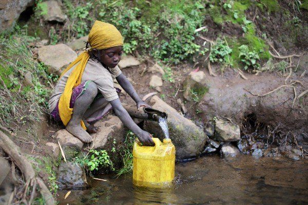 Children doing house work (fetching water)