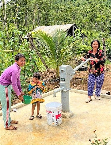 Family with deep well in Cambodia
