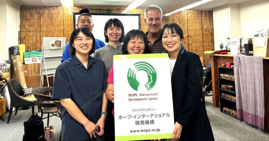 HOPE Japan staff posing in the HOPE Office