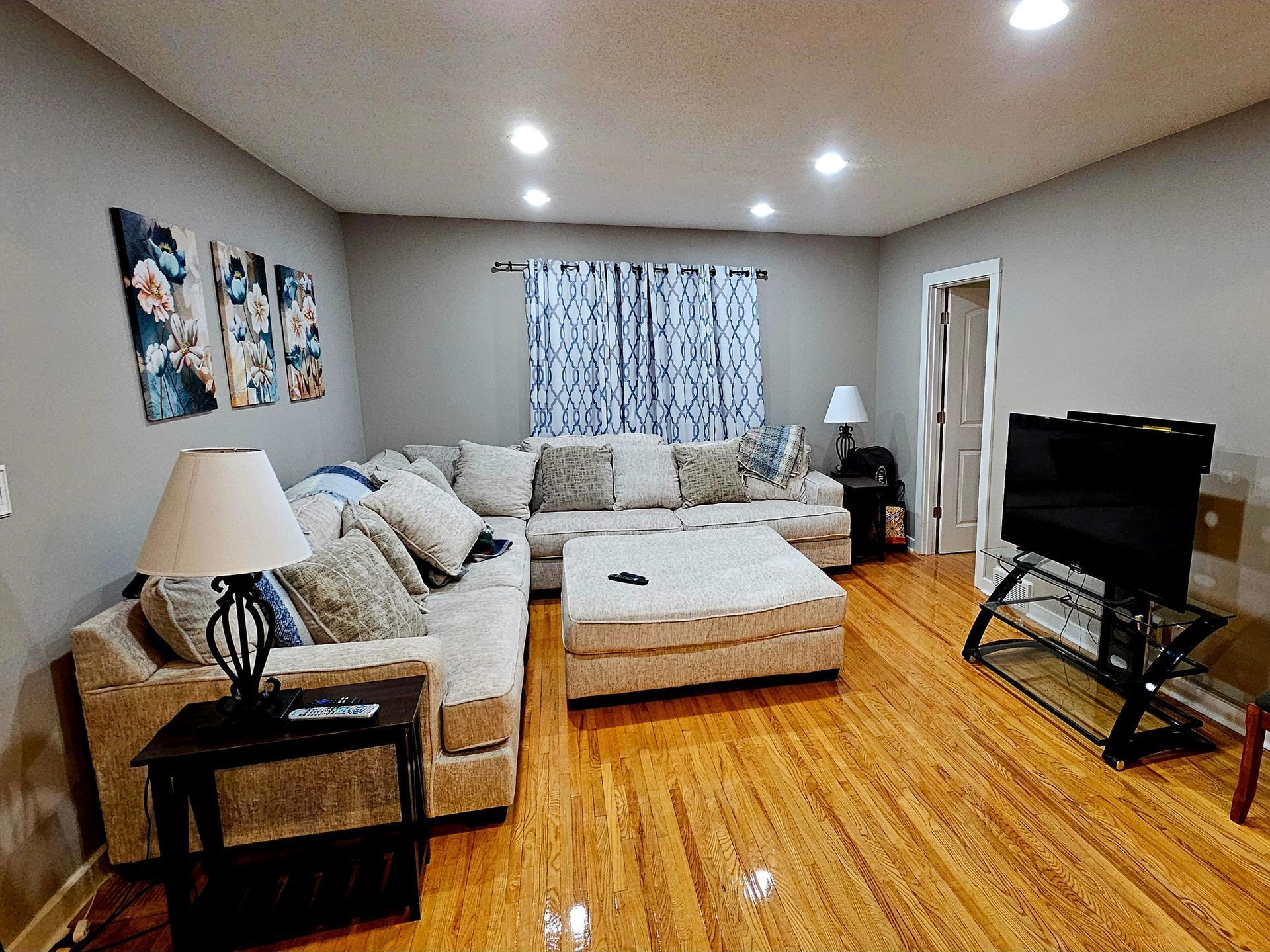 A living room filled with furniture and a flat screen tv