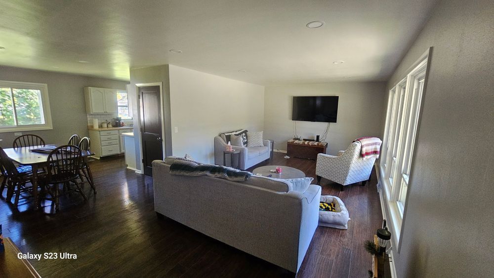 A living room filled with furniture and a flat screen tv