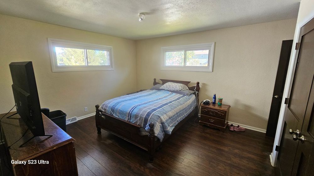 A bedroom with a bed