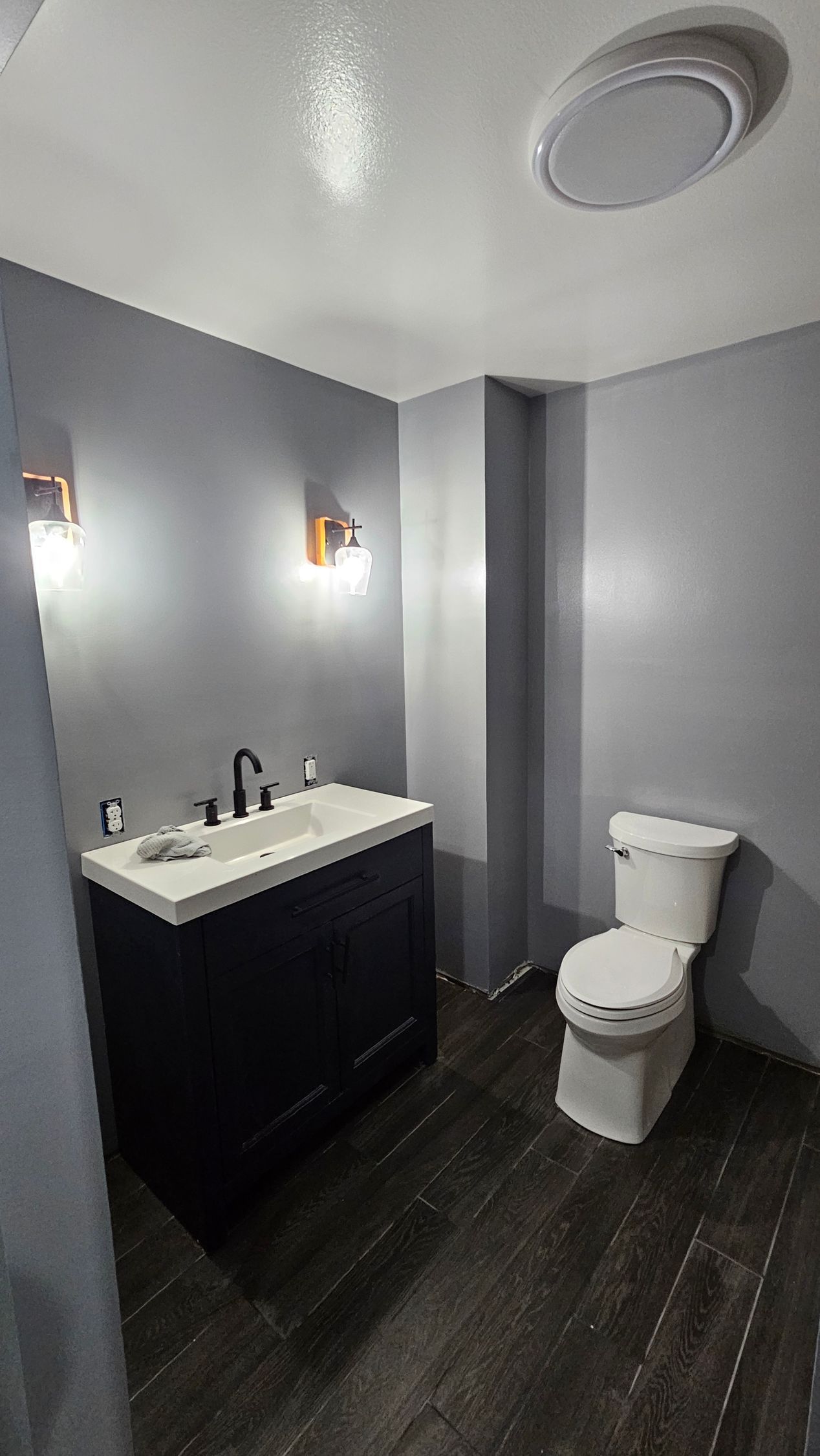 A bathroom with a sink and toilet in it