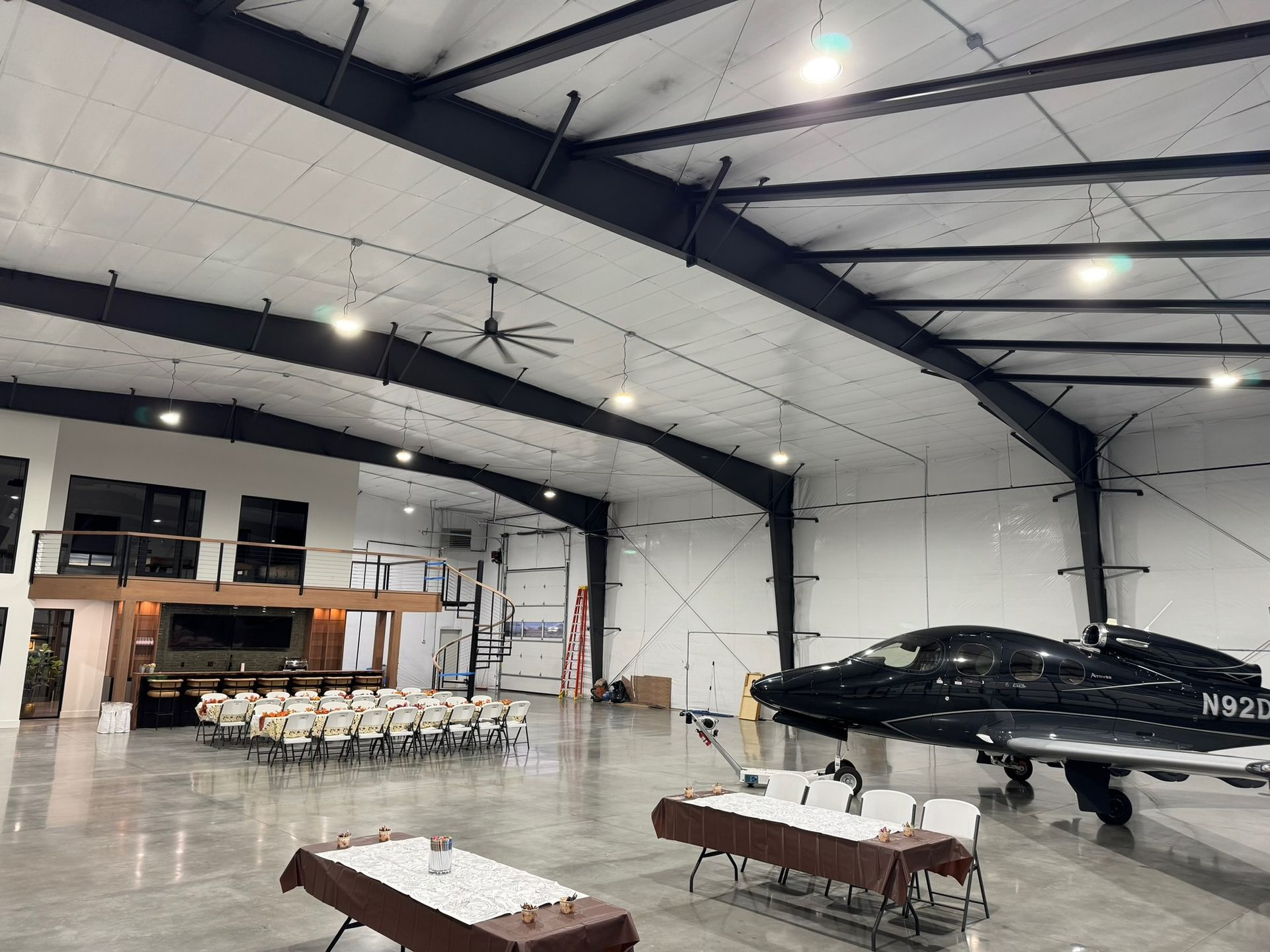 Chair rentals set up inside a large indoor venue for an event in Logan Utah