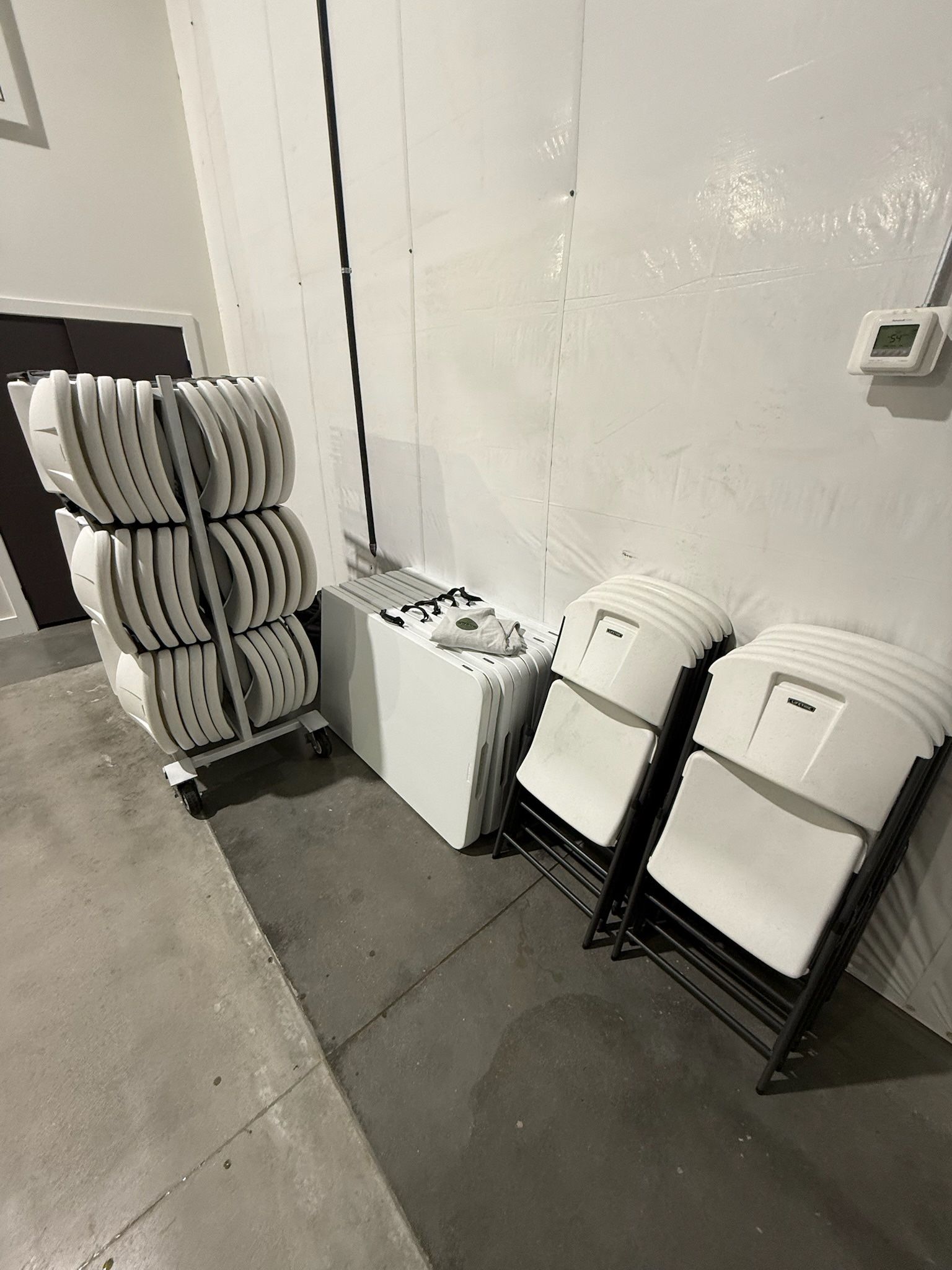 Stacked chairs prepared for event rental delivery and pickup services