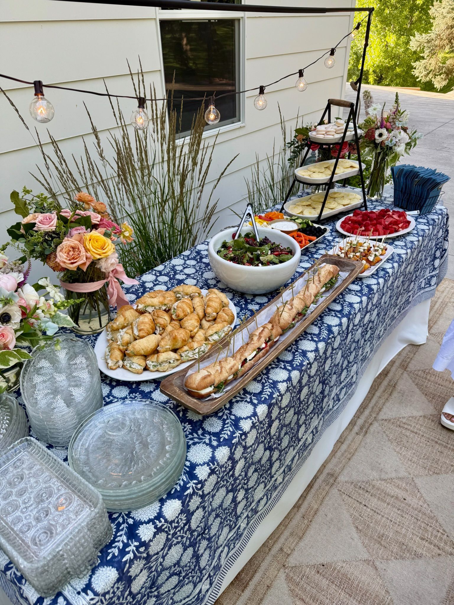 Dinner table rental setup with food and decor for an event
