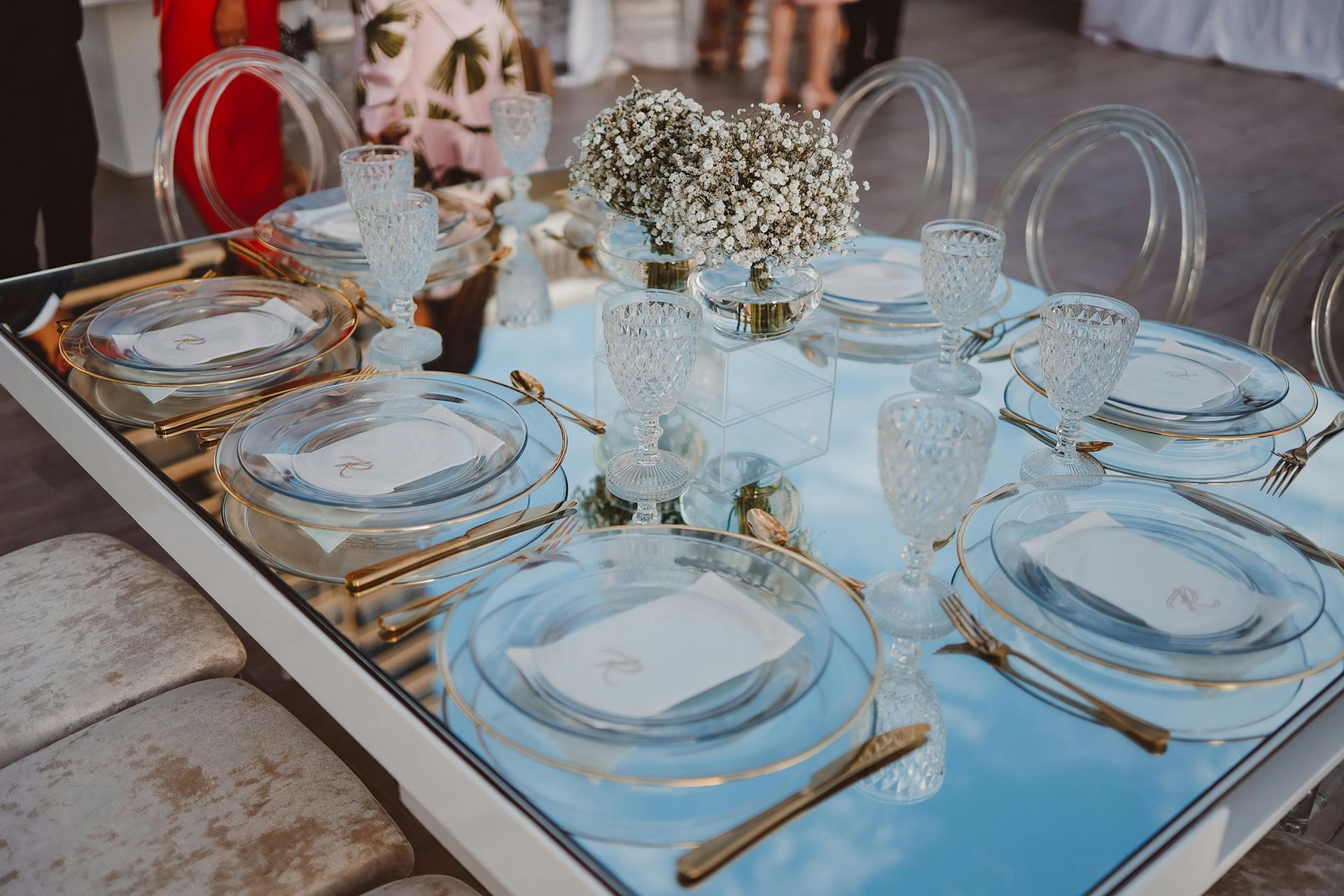Formal table setup with rental tables and place settings for an event