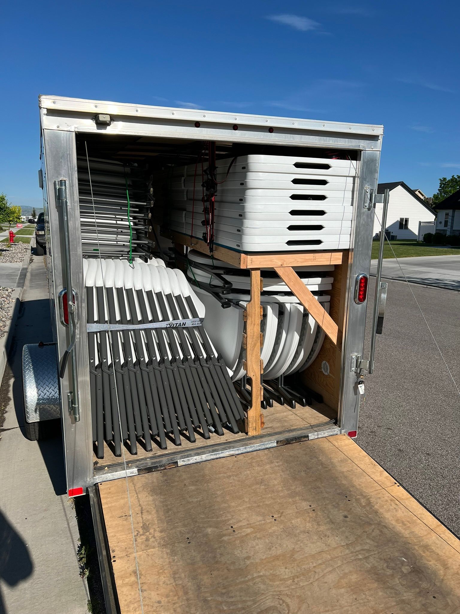 Rental tables loaded in a trailer for delivery to an event
