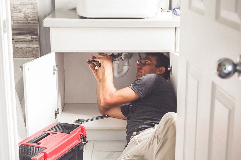 Fixing The Pipe — Goldsboro, NC — Quality Plumbing & Heating Co.