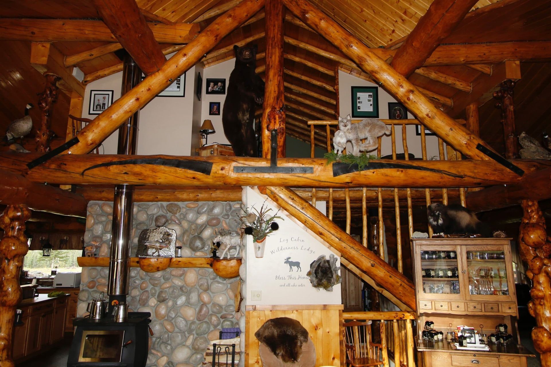 A log cabin with a bear on the ceiling