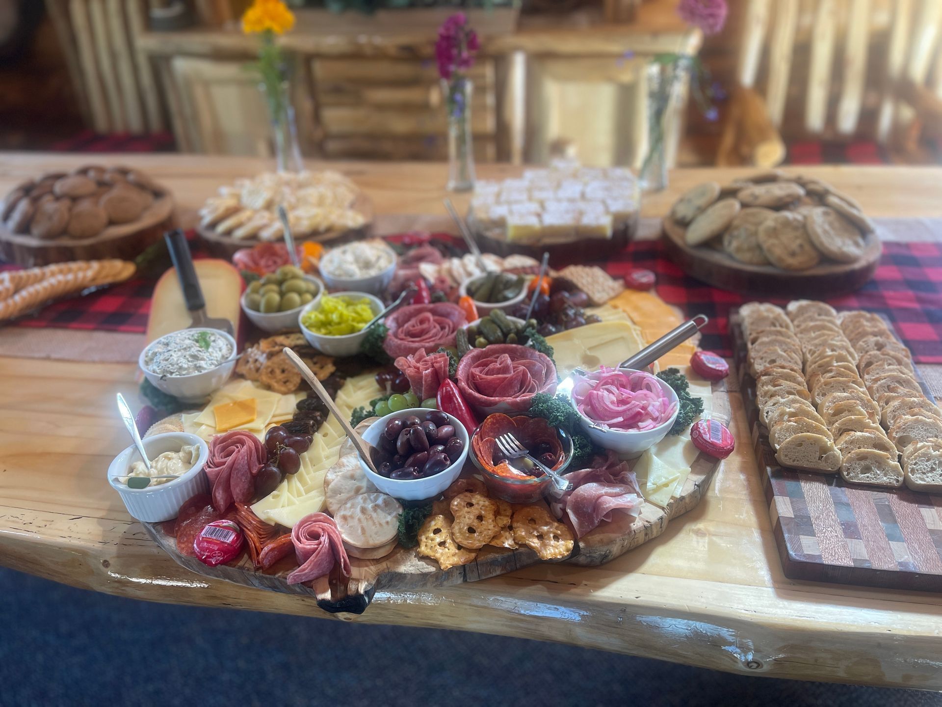 A river flowing through a valley at sunset with mountains in the background.