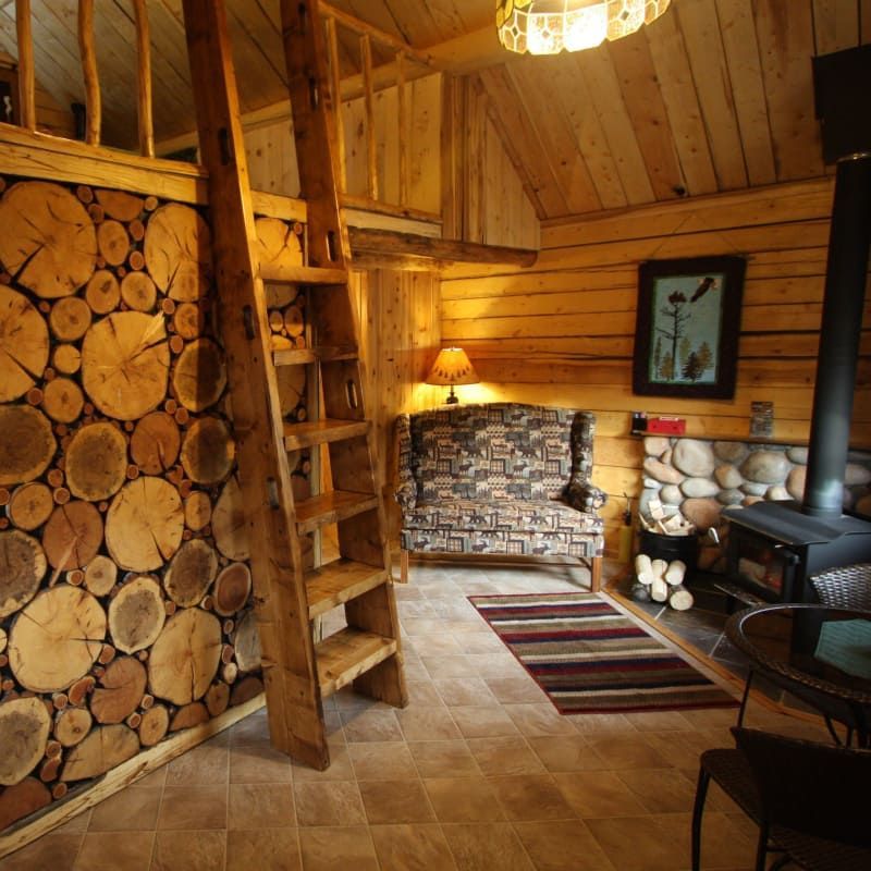 A living room with a staircase and a fireplace