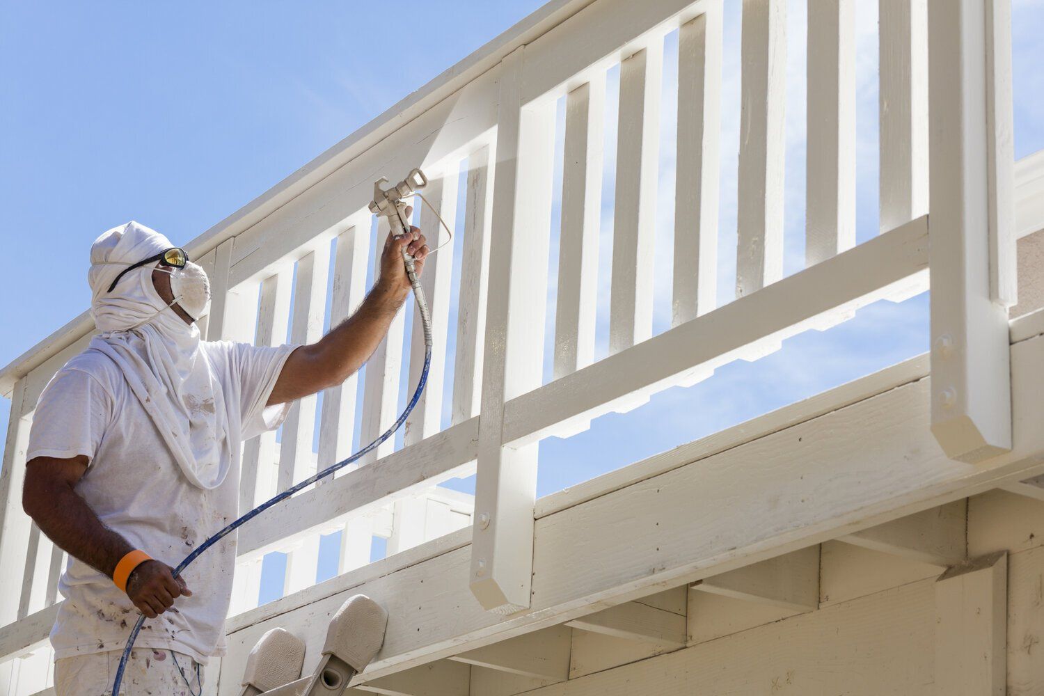 Is it better to roll or spray the exterior paint on your house