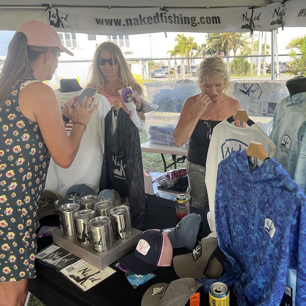 A white boat with a blue roof is floating on the water