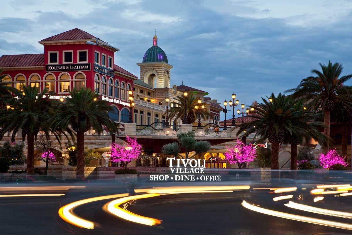 Evening photo of Tivoli Village with decorative lights on the street